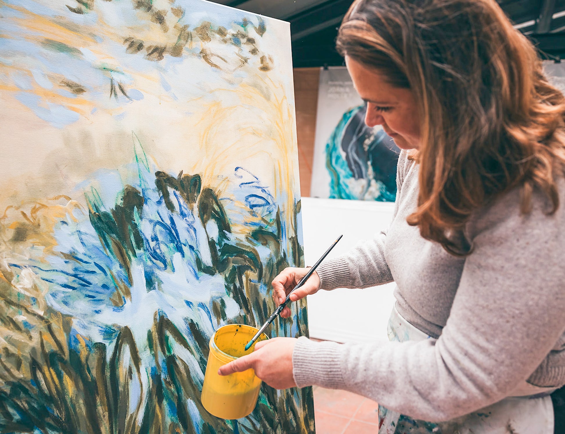 Joana Mollet Artist working on Agapanthus painting